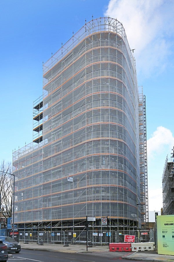 Assemble the next scaffold level from a safe position with no additional fall protection required.