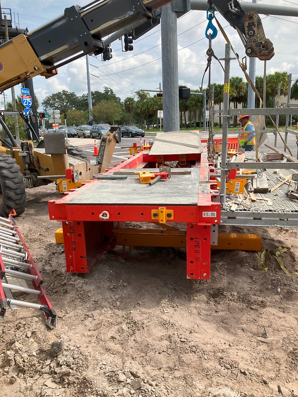 The dancefloor is being reassembled at the next location. The scaffold brackets and deck boards were removed to fit the unit on a legal flatbed haul truck and can be replaced in minutes by the crew.