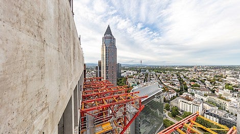 An access scaffold was erected using components from the PERI UP Scaffolding Kit during the process of assembling and disassembling the console brackets on the building.