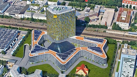 The new ADAC headquarters is comprised of a five-storey, undulating curved base structure with a large courtyard. The office tower continues upwards for another 18 floors.