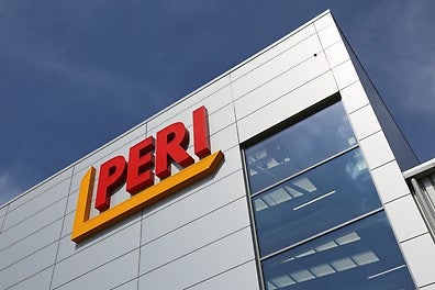 Exterior view of the PERI UK office, featuring the company logo, signifies a commitment to supporting employees with new menopause guidance. Illustrating workplace wellness and inclusivity.