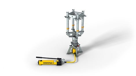 Die Hydraulik-Einheit besteht aus Hubzylinder und Handpumpe. Am Manometer lassen sich sowohl der Druck [bar] als auch die Kraft [kN] ablesen.