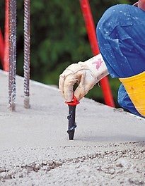 The Screw-On Sleeve M16/164 is inserted into the fresh concrete requiring only two turns of the sleeve and applying gentle pressure. The end cap is used here as a handhold and reliably protects the inner thread. The slab feet for the PROKIT side protection can be securely mounted by means of commercially available M16 bolts without any subsequent drilling.