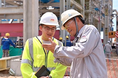 Mr Edwin Ng, PERI Singapore Project Manager in discussion with Mr Zhang Zhan, Site Manager of Project Spring