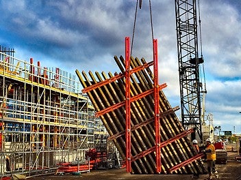 The panels joined together with the help of steel walers and couplings, which allow the form to be moved as an integrated unit.