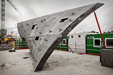 Before the main construction had started, a full-size sample panel with reverse curvature and slope was constructed on site.