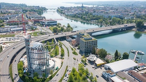 In Konstanz am Bodensee entsteht ein über 50 m hohes, zylindrisches Panoramagebäude aus Holz und Beton, eigens errichtet für ein 360-Grad-Panorama des Künstlers Yadegar Asisi.