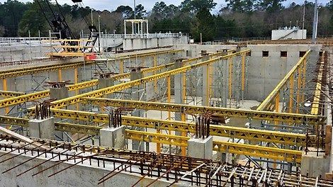 Preassembled towers are flown into place before the decking and reinforcement for the walkway is installed