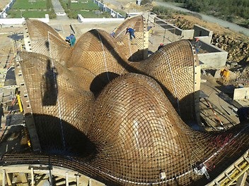 the intricate roof design was shaped through using customized girder trusses