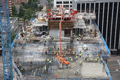 The high capacity hydraulic cylinders allow carrying the concrete placing boom on top of the system which facilitates pouring of the decks around the core.