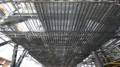 Drop-in decking features standard grid widths and integrated locks to prevent uplift