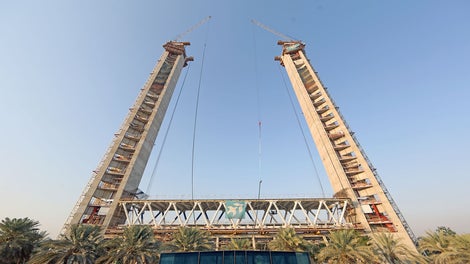 In order to strengthen the structure of the towers to take the weight of 3,000-tonne of the skybridge, the last slabs had a thickness of 1.4m and cantilevered around 3.5m to the outer side of each tower. In this case load were not transferred vertically but horizontally by using steel beams. 