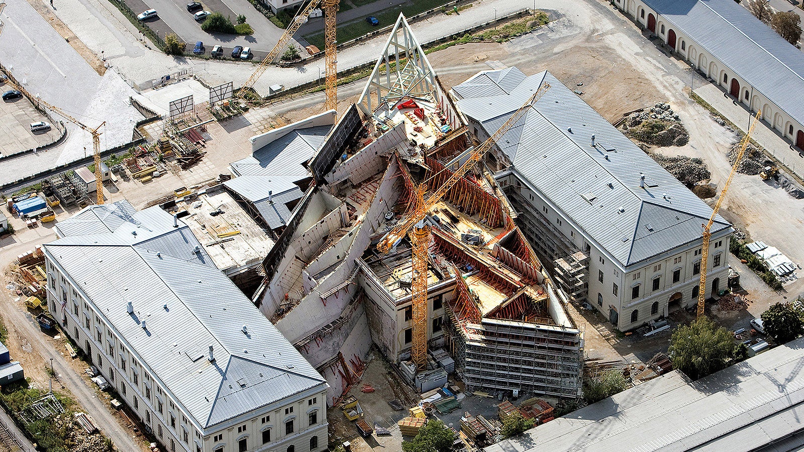The almost 100 m long Libeskind-designed structure features a 30-metre high wedge tip made of glass and steel.